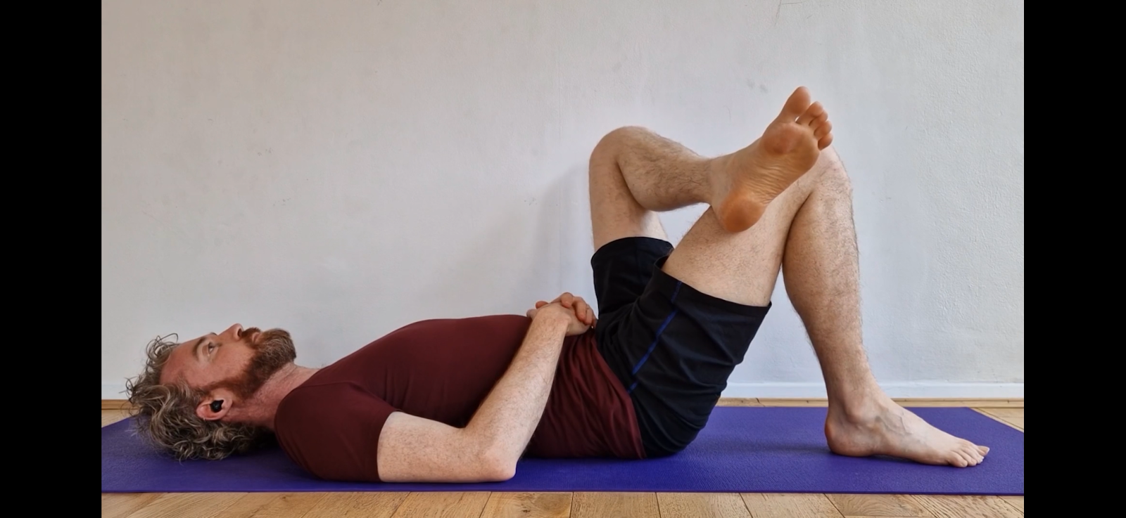 PLACE LEFT ANKLE ON RIGHT KNEE